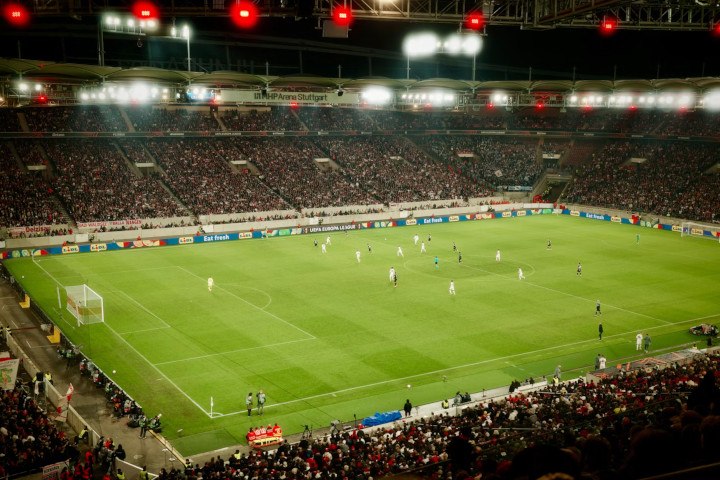 Football/Soccer Game Played in-a Stadium at Night